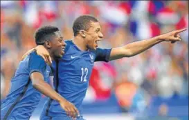 ?? AFP ?? Ousmane Dembele (left) scored the winner in 10man France’s win over England in Paris.