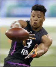  ?? DARRON CUMMINGS — THE ASSOCIATED PRESS ?? Penn State running back Saquon Barkley runs a drill during the NFL football scouting combine, Friday in Indianapol­is.