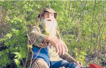  ??  ?? David Lidstone, 81, for nearly three decades has lived in the woods of Canterbury, New Hampshire, along the Merrimack River in a shack, growing his own food. He’s now jailed after not complying with a court order to leave his home.