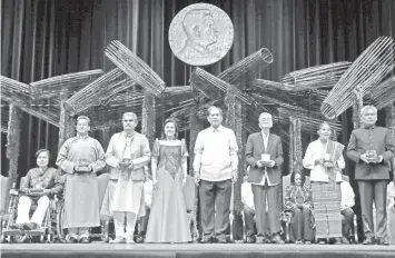  ?? ASSOCIATED PRESS ?? The 2018 Ramon Magsaysay awardees pose with Vice-President Leni Robredo, fourth from left, and Senen Bacani, Chair of the Board of Trustees, fifth from left, following awarding ceremony at the Cultural Center of the Philippine­s in Manila.
