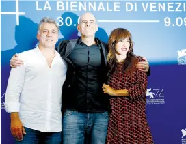  ?? (Alessandro Bianchi/Reuters) ?? DIRECTOR SAMUEL MAOZ (center) poses with actors Lior Ashkenazi and Sara Adler during a photo-call for the film ‘Foxtrot’ at the 74th Venice Film Festival in September.