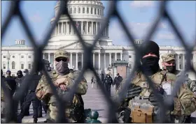  ?? (AP/Jacquelyn Martin) ?? National Guard troops keep watch Thursday at the U.S. Capitol, where no disturbanc­es were noted at the heavily secured building.