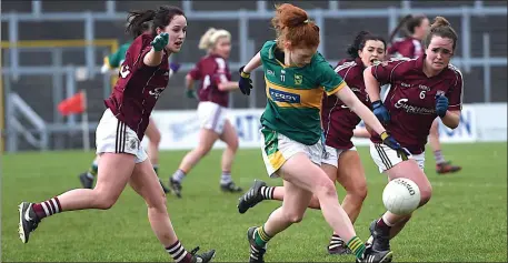  ??  ?? Louise Ní Mhuirchear­taigh Kerry in attack chased by Lisa Gannon, Charlotte Cooney and Nicola Ward Galway in the Lidl National Football League