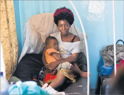  ?? JEROME DELAY/AP ?? Ado Ntanga and her son have been detained, unable to pay $850 for the boy’s sickle cell anemia treatment.