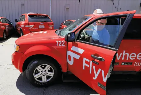  ?? Photos by Michael Macor / The Chronicle ?? Taxi driver Bobby Soltanian returns his cab to the yard. Cabbies are divided on how to spend money in their medallion fund.