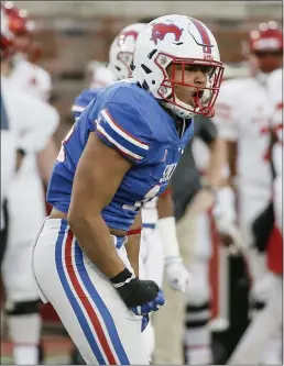  ?? BRANDON WADE — THE ASSOCIATED PRESS ?? SMU linebacker Richard Moore (14) celebrates sacking Houston quarterbac­k D’Eriq King, not pictured, during the first half of an NCAA college football game in Dallas.