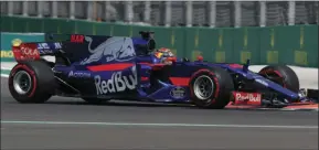  ??  ?? Toro Rosso driver Brendon Hartley, of New Zealand, steers his car during the second practice session for the Formula One Mexico Grand Prix auto race at the Hermanos Rodriguez racetrack, in Mexico City, on Friday. AP PHOTO/MOISES CASTILLO