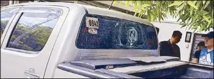  ?? ?? The rear windshield of Bureau of Correction­s chief Gregorio Catapang Jr.’s Toyota Hilux is shattered following a gun attack along the Skyway in Quezon City yesterday.