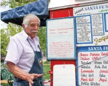  ?? ADRIANA SANCHEZ/FOR THE NEW MEXICAN ?? Roque Garcia, owner of Roques Carnitas, talks about being featured on an Australian TV show. He has served food on the Plaza for 33 years.