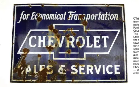  ??  ?? 1998 Chevrolet sign from the MooneyBark­er Drug Store, Pettigrew (Madison County), 1930s. The Mooney-Barker Drug Store served the small lumber town of Pettigrew for nearly 70 years, selling everything from “drugs to axle grease” to meet customers needs....