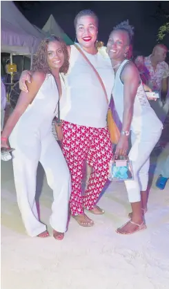  ??  ?? From left: Liniesha Davis, Robyn Hall, and Annesha Cummings are having a grand time at the Negril Internatio­nal Food and Wine Festival.