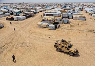  ?? AP PHOTO/BADERKHAN AHMAD ?? Kurdish forces patrol al-Hol camp, which houses families of members of the Islamic State group, in 2023 in the Hasakeh province of Syria.