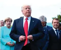  ??  ?? Donald Trump under G7-møtet helga. Angela Merkel til venstre og Emmanuel Macron til høyre.