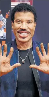  ?? PHOTO: JORDAN STRAUSS/INVISION/AP ?? Lionel Richie says getting his handprints at the forecourt of the iconic Los Angeles theatre was a childhood dream