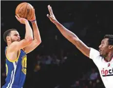  ?? AP ?? Golden State Warriors guard Stephen Curry (left) in action against Portland Trail Blazers Monday in Portland on Monday.