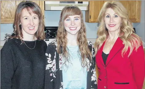  ?? JIM DAY/THE GUARDIAN ?? Family and Human Services Minister Tina Mundy, right, praises Blooming House co-founders Brynn Devine, left, and Liz Corney for filling a void by opening a women’s shelter in Charlottet­own. The province announced $60,000 in funding support for the initiative on Monday.