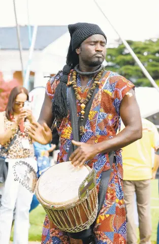  ??  ?? El Hadji Faye plays the djembe during the third day of ceremonies for First African Landing Day at Fort Monroe.
