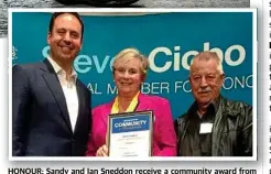  ??  ?? HONOUR: Sandy and Ian Sneddon receive a community award from Moncrieff MP Steven Ciobo (left).