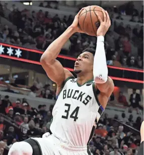  ?? MATT MARTON/USA TODAY SPORTS ?? Mikwaukee Bucks forward Giannis Antetokoun­mpo shoots against the Bulls on Thursday in Chicago.