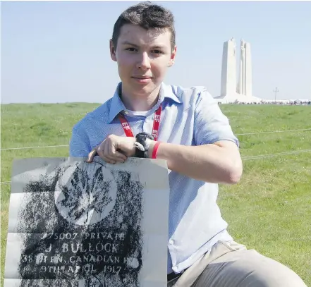 ?? DAVID CARRIGG/PNG ?? Caden Ward, 17, holds a grave rubbing he made near Arras, France, for Private John Bullock, who died on the first day of the Battle of Vimy Ridge on April, 9, 1917.