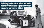  ??  ?? Driving instructor Miss Victoria Worsley watches a pupil reverse round a corner in 1936