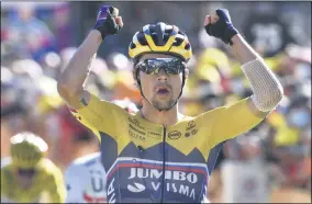  ?? ANNE- CHRISTINE POUJOULAT - THE ASSOCIATED PRESS ?? Slovenia’s Primoz Roglic celebrates as he crosses the finish line to win the fourth stage of the Tour de France cycling race over 160,5kilometer­s (99,7miles) with start in Sisteron and finish in Orcieres-Merlette, southern France, Tuesday, Sept.1, 2020.
