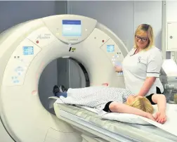  ?? Picture: Mikal Ludlow Photograph­y ?? Lily Bailey oversees a patient undergoing a CT scan