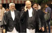  ?? — PRITAM BANDYOPADH­YAY ?? Congress leader Abhishek Singhvi leaves the Supreme Court in New Delhi on Friday after a hearing in Karnataka government formation case.