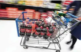  ?? Karsten Moran / New York Times ?? A nutrition professor at New York University says “it’s pretty shocking” that the No. 1 purchase of households that use foods stamps is soft drinks.