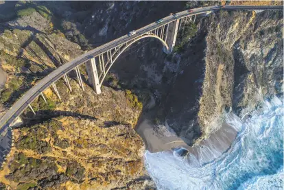  ?? Photos by Carlos Avila Gonzalez / The Chronicle ?? Tourists can’t resist the views from Bixby Creek Bridge outside Big Sur, but the hordes are detrimenta­l, locals say.