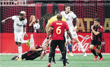  ?? — JOHN DAVID MERCER/USA TODAY SPORTS FILES ?? Vancouver Whitecaps defender Kendall Waston, left, was handed a red card for elbowing Atlanta’s Leandro Gonzalez after the referee checked the video review.