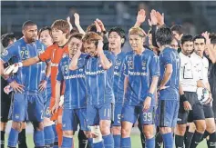  ??  ?? Japan’s Gamba Osaka team members celebrate their victory over South Korea’s Seongnam FC during the AFC Champions League group F match in Osaka. — AFP photo