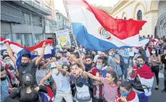  ??  ?? ANGRY AT GOVERNMENT: Paraguayan­s protest against President Mario Abdo Benitez’s health policies and the lack of vaccines in Asuncion, Paraguay, on Friday.