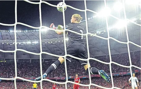  ?? Picture: Getty. ?? Loris Karius lets Gareth Bale’s long-range drive slip through his hands for Madrid’s third goal.