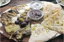  ??  ?? VEGETARIAN antipasto board, with olive tapenade and Gorgonzola sauce.