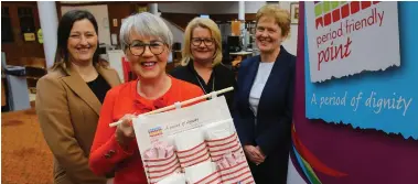  ?? Picture: Colin Mearns ?? Eleanor Gibson holds a Period Friendly point, joined by Councillor Jennifer Layden, Lorraine McGrath, CEO of the Simon Community Scotland, and Maureen McKenna, Executive Director of Education Services