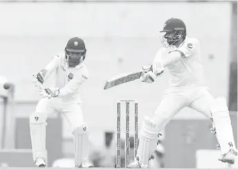  ??  ?? Pakistan opener Azhar Ali cuts during his unbeaten 85 on the opening day of the third Test against West Indies at Windsor Park yesterday. (Photo courtesy WICB Media)