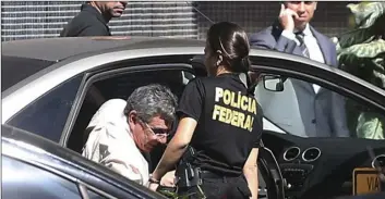  ??  ?? This photo released by Agencia Brasil shows, Tadeu Filippelli, special aide to embattled Brazilian President Michel Temer, arriving to federal police headquarte­rs after his arrest in Brasilia, Brazil on Tuesday. Filippelli was arrested in connection with a fraud investigat­ion into the renovation­s of the Brasilia stadium for the 2014 World Cup. Brazil’s federal police say the constructi­on works were overpriced by more than $260 million. AGENCIA BRASIL AP PHOTO/JOSE CRUZ