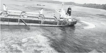  ??  ?? File photo shows the oil spill from the MV Solomon Trader along the coastline of Rennell Island, south of the capital Honiara. — AFP photo