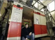  ?? MICHAEL SOHN — THE ASSOCIATED PRESS ?? In this Friday photo Tobias Hirsch sits in the entrance of the ‘Historic City Train Driving Simulator’ in Berlin, Germany.