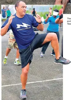  ??  ?? Minister of Health Dr Christophe­r Tufton shows how serious he is about health.