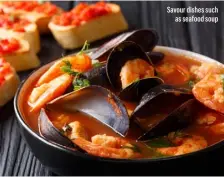  ??  ?? Savour dishes such as seafood soup