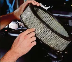  ?? METRO NEWS SERVICE PHOTO ?? Replacing air filters is an inexpensiv­e way to keep vehicles performing at peak capacity.