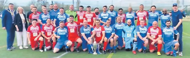  ?? ?? Players from both teams, match officials, and Cllr Gordon Johnson, Mayor of West Lancashire Borough Council with representa­tives of the Birchwood Centre Charity all together with the FA Amateur Cup