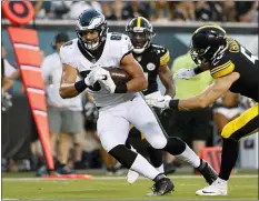  ?? THE ASSOCIATED PRESS FILE ?? Eagles tight end Dallas Goedert, left, is looking to make some moves on his namesake team Sunday night.