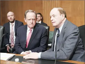  ?? (AP) ?? Sen Pat Toomey, R-Pa (left), and Sen Richard Shelby, R-Ala, talk as they prepare to hear from President Donald Trump’s nominee to the Federal Reserve, Judy Shelton, during her confirmati­on hearing at the Senate Finance
Committee, on Capitol Hill in Washington on Feb 13.