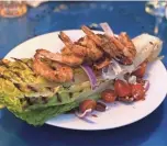 ?? JENNIFER CHANDLER ?? The BS Grilled Romaine Salad with Grilled Shrimp at The Beauty Shop.