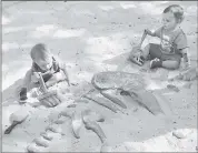  ?? STAFF FILE PHOTO ?? Zane Kenner, 1, of San Jose, and Jacob Dewey, 1, of San Jose, left to right, play in the Dino Dig attraction at Happy Hollow Park & Zoo. The lower portion of the zoo, including the Dino Dig area, was heavily damaged earlier this year by flooding from...