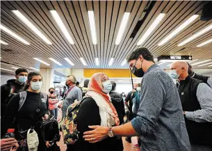  ?? SEAN KILPATRICK THE CANADIAN PRESS ?? Prime Minister Justin Trudeau greets commuters at a Montreal Metro station Tuesday.