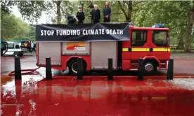  ??  ?? Extinction Rebellion’s ‘blood protest’ outside the Treasury last week. Photograph: Simon Dawson/Reuters